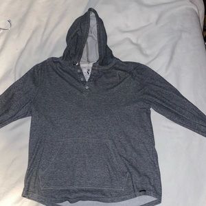 Grey hooded sweater on the byas